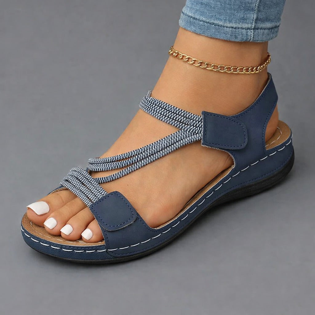 Lightweight orthopedic sandals for women featuring a cushioned footbed and adjustable straps, designed with a modern strappy look for comfort and style. 5