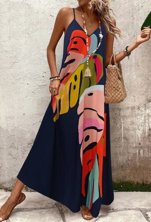 Maxi dress featuring a vibrant tropical leaf print, sleeveless V-neck design, and made from lightweight fabric, perfect for casual summer outings for women. 2
