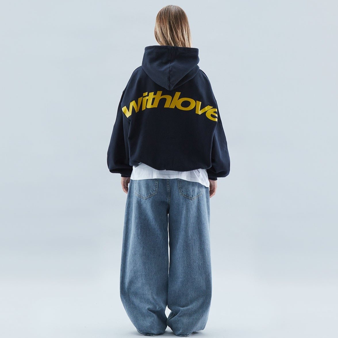 Oversized hoodie featuring a stylish graphic design, made from heavyweight cotton-blend fleece, showcasing modern streetwear style with a convenient kangaroo pocket. 0