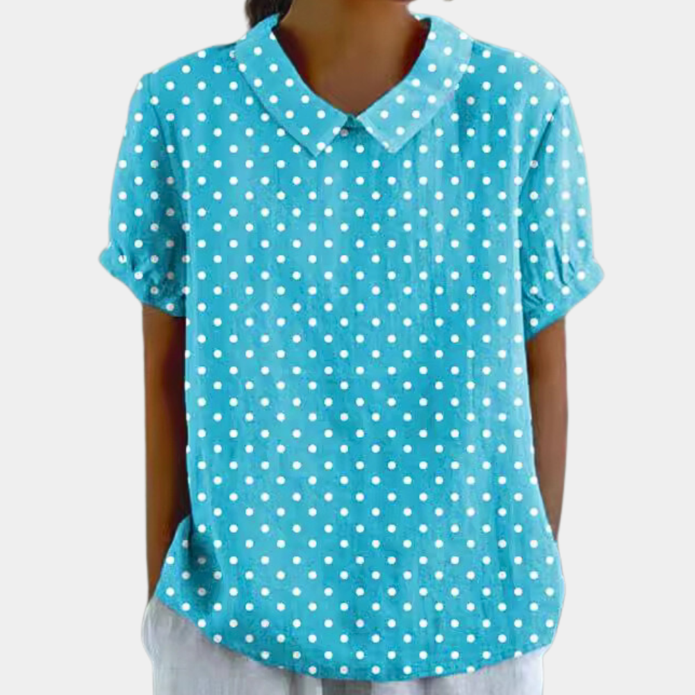 Women's blouse featuring a stylish Peter Pan collar, made from breathable fabric for comfort, designed in a loose fit for a chic summer look. 2