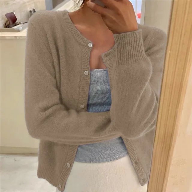 Women's cropped cardigan in white with button front, featuring a soft knit fabric and relaxed fit, perfect for layering in any season. 4