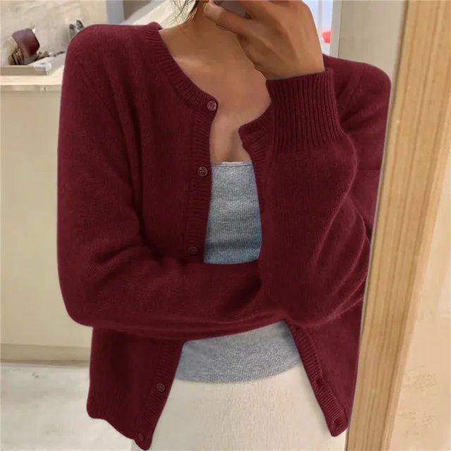 Women's cropped cardigan in white with button front, featuring a soft knit fabric and relaxed fit, perfect for layering in any season. 6