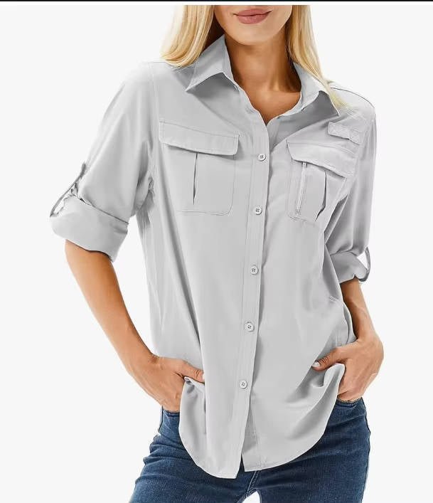 Women's hiking shirt featuring UPF 50 sun protection, breathable fabric, and roll-up sleeves, ideal for safari trekking and outdoor adventures. 1