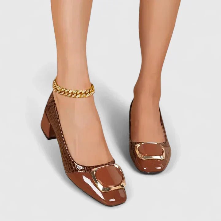 Women's croc-embossed patent leather loafers with block heel and stylish chain detail in a glossy finish. 5