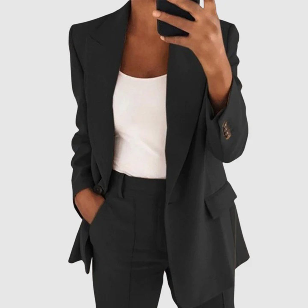 Elegant women's suit featuring a tailored blazer and high-waist trousers, perfect for office wear, showcasing a sophisticated design in a chic color palette. 0