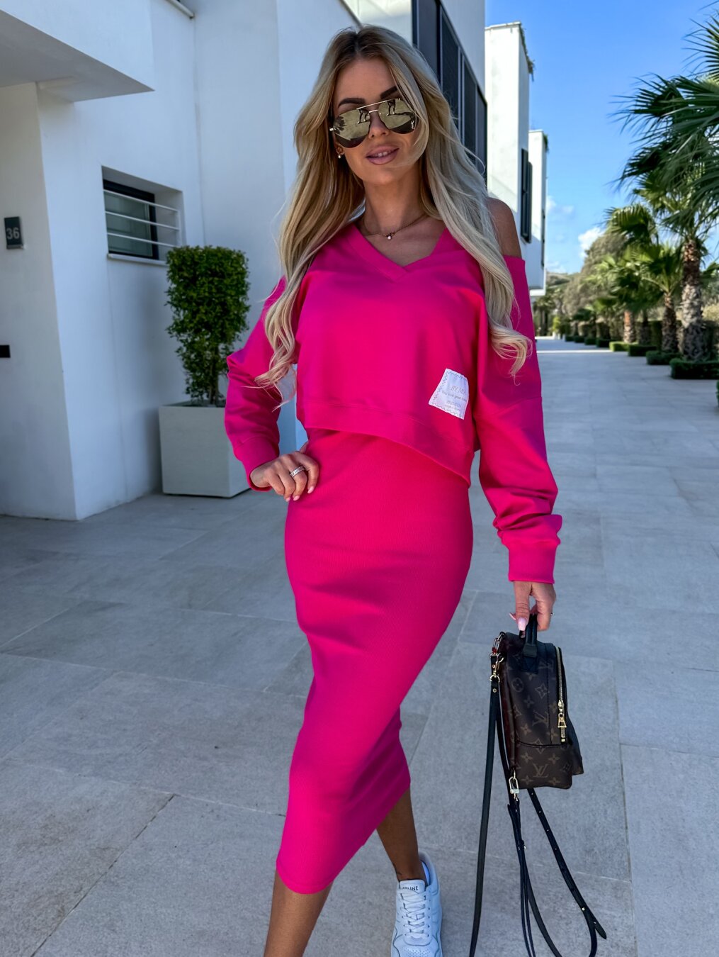 Women's two piece set featuring a chic midi dress paired with a cozy sweatshirt, perfect for versatile styling and comfortable wear. 4