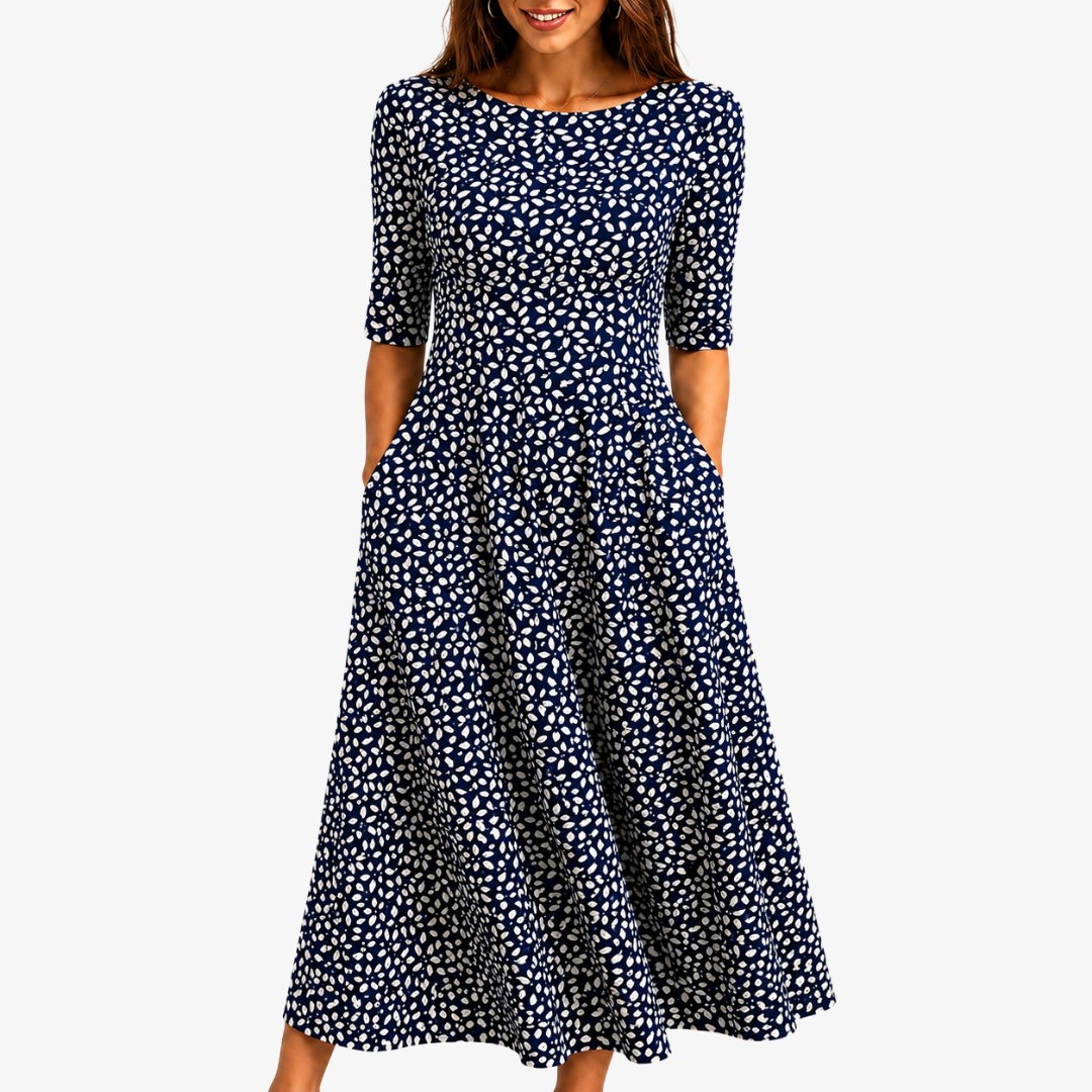 Womens navy floral print maxi dress featuring a flowing silhouette and convenient side pockets, perfect for summer events. 0