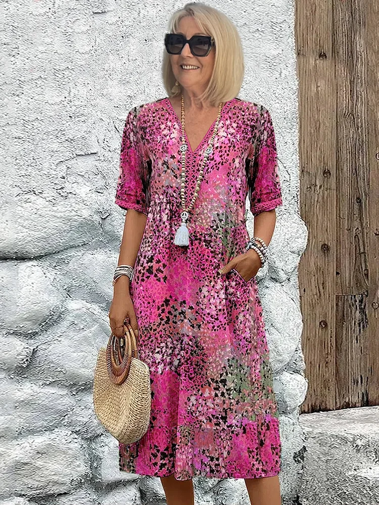 Womens summer dress featuring a V-neck design and vibrant floral pattern, knee-high length, comfortable fit, and plus sizes available for a stylish and flattering 2