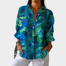 Colorful printed women's blouse with a loose fit, featuring a lightweight design perfect for summer wear. 0