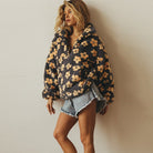 Floral Teddy Fleece Half Zip Jacket featuring a retro daisy print in an oversized sherpa style, perfect for cozy casual wear. 2