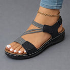 Lightweight orthopedic sandals for women featuring a cushioned footbed and adjustable straps, designed with a modern strappy look for comfort and style. 2