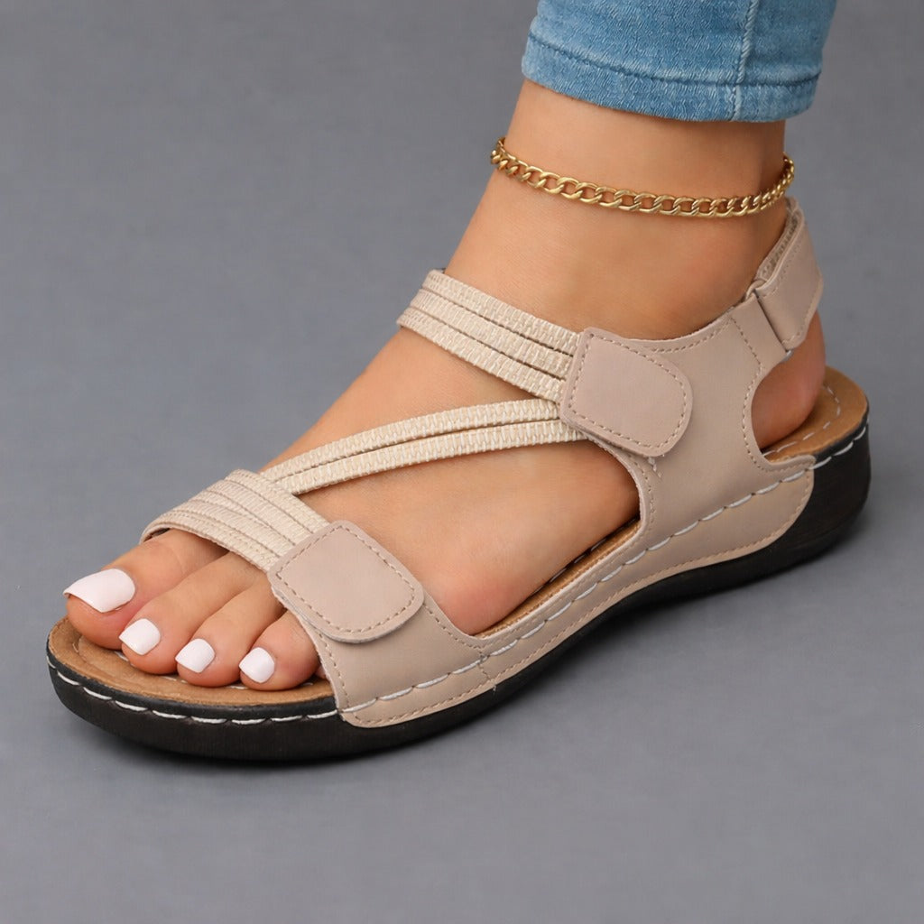 Lightweight orthopedic sandals for women featuring a cushioned footbed and adjustable straps, designed with a modern strappy look for comfort and style. 4