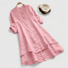 Linen shirt dress with asymmetric layered hem, featuring a versatile button-down design, perfect for summer wear in plus sizes. 1