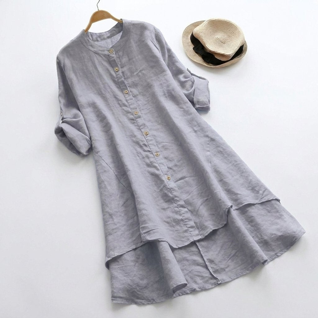 Linen shirt dress with asymmetric layered hem, featuring a versatile button-down design, perfect for summer wear in plus sizes. 4