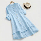Linen shirt dress with asymmetric layered hem, featuring a versatile button-down design, perfect for summer wear in plus sizes. 5
