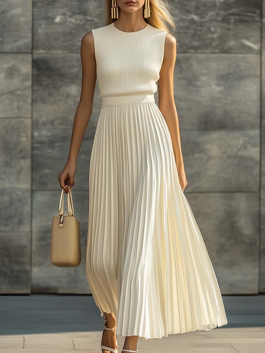 Maxi dress featuring a sleeveless knit bodice and a flowing pleated chiffon hem, designed for women in an elegant cream color. 0