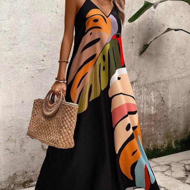 Maxi dress featuring a vibrant tropical leaf print, sleeveless V-neck design, and made from lightweight fabric, perfect for casual summer outings for women. 0
