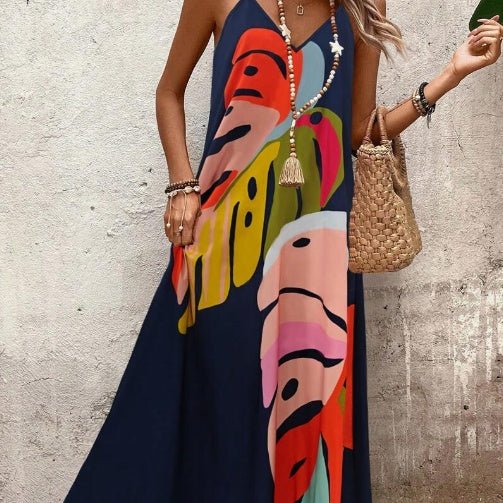 Maxi dress featuring a vibrant tropical leaf print, sleeveless V-neck design, and made from lightweight fabric, perfect for casual summer outings for women. 1