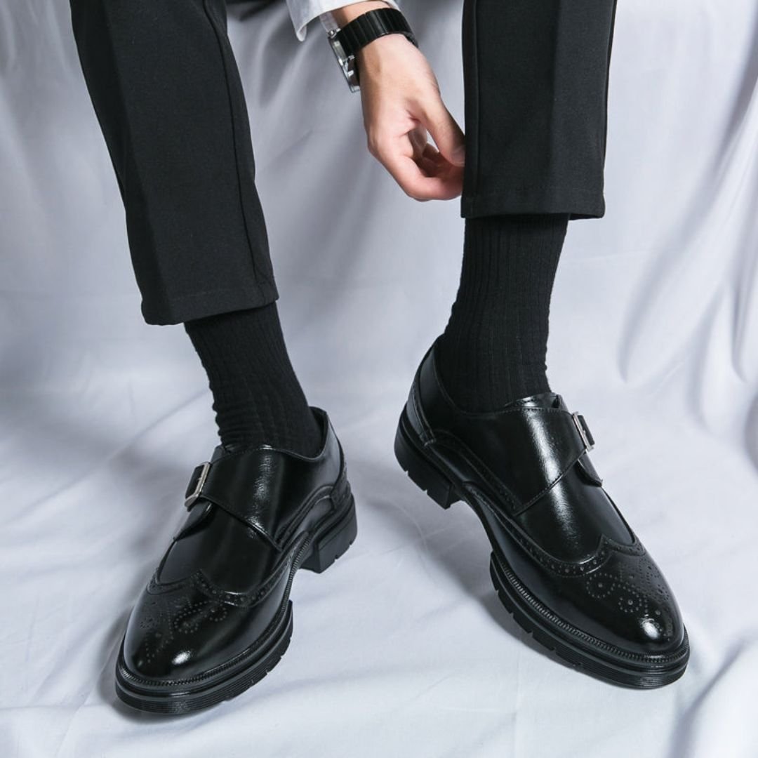 Men's black leather dress shoes featuring elegant wingtip brogue detailing and a stylish monk strap closure, perfect for formal occasions and versatile enough for any wardrobe 0
