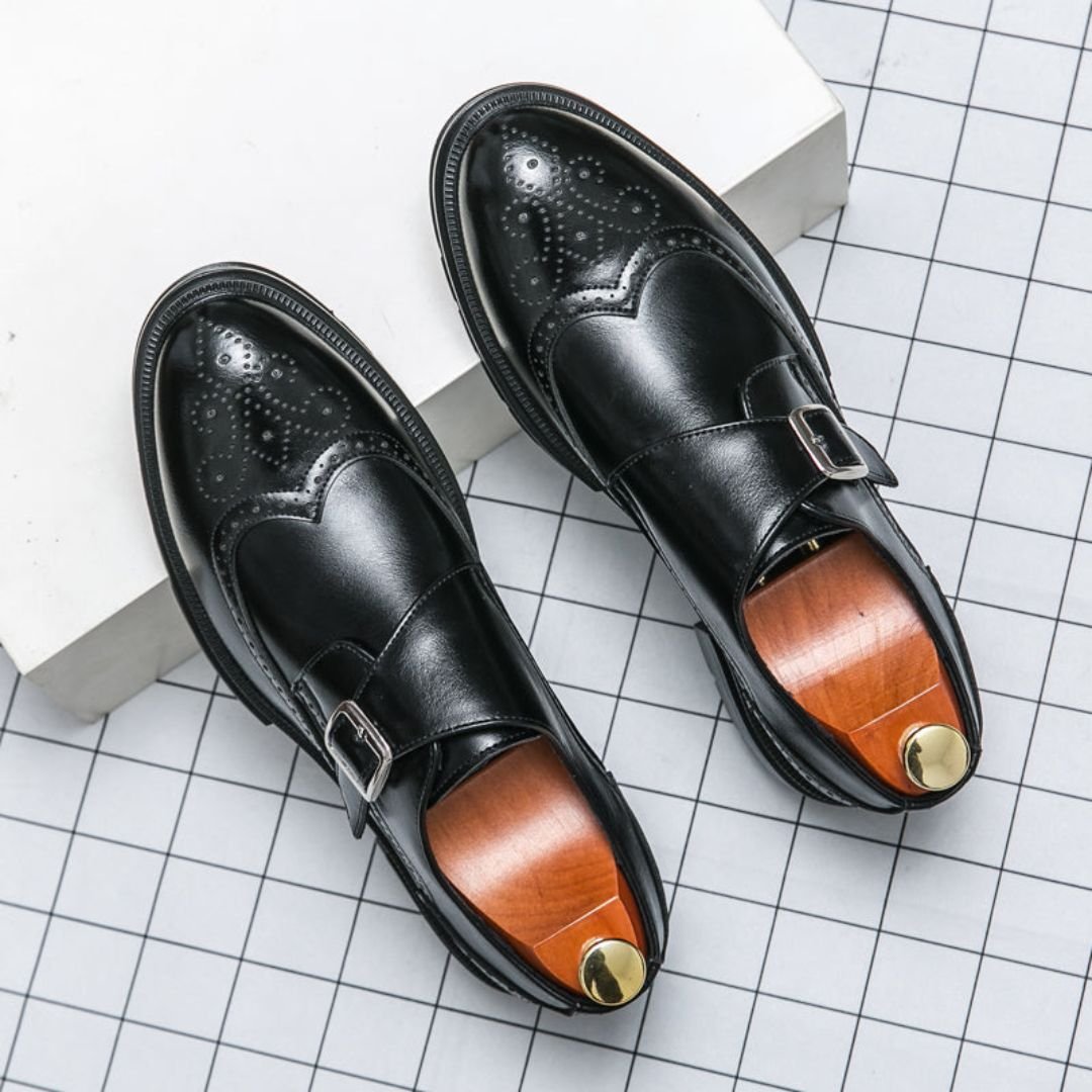 Men's black leather dress shoes featuring elegant wingtip brogue detailing and a stylish monk strap closure, perfect for formal occasions and versatile enough for any wardrobe 1