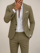 Men's slim fit suit in a modern two-piece design, featuring a comfortable fit ideal for winter events, showcasing a stylish blazer and tailored trousers. 0