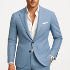 Men's slim fit suit in a modern two-piece design, featuring a comfortable fit ideal for winter events, showcasing a stylish blazer and tailored trousers. 1