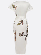 Elegant midi wrap dress featuring a flattering V-neck and vibrant floral print, designed with a stylish tie-waist for a perfect fit. Ideal for wedding guests 6