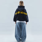 Oversized hoodie featuring a stylish graphic design, made from heavyweight cotton-blend fleece, showcasing modern streetwear style with a convenient kangaroo pocket. 0