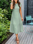 Elegant tiered maxi dress featuring tummy control and cap sleeves, designed for a flattering A-line silhouette, perfect for any occasion. 3