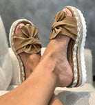 Wedge sandals for women featuring a stylish bow detail, cushioned comfort, and an elegant woven design, perfect for summer outings. 4