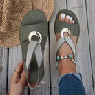 White flat sandals for women featuring a stylish metal buckle, designed for comfort and easy slip-on wear, perfect for summer outings. 2