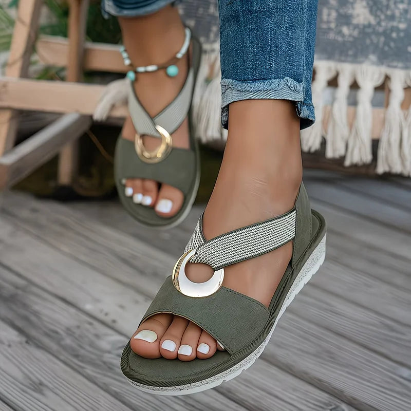 White flat sandals for women featuring a stylish metal buckle, designed for comfort and easy slip-on wear, perfect for summer outings. 5