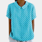 Women's blouse featuring a stylish Peter Pan collar, made from breathable fabric for comfort, designed in a loose fit for a chic summer look. 2