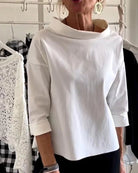 Women's cowl neck top with 3/4 sleeves in a versatile solid design, featuring a relaxed fit for effortless style and comfort. 0