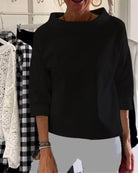 Women's cowl neck top with 3/4 sleeves in a versatile solid design, featuring a relaxed fit for effortless style and comfort. 2