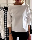 Women's cowl neck top with 3/4 sleeves in a versatile solid design, featuring a relaxed fit for effortless style and comfort. 3