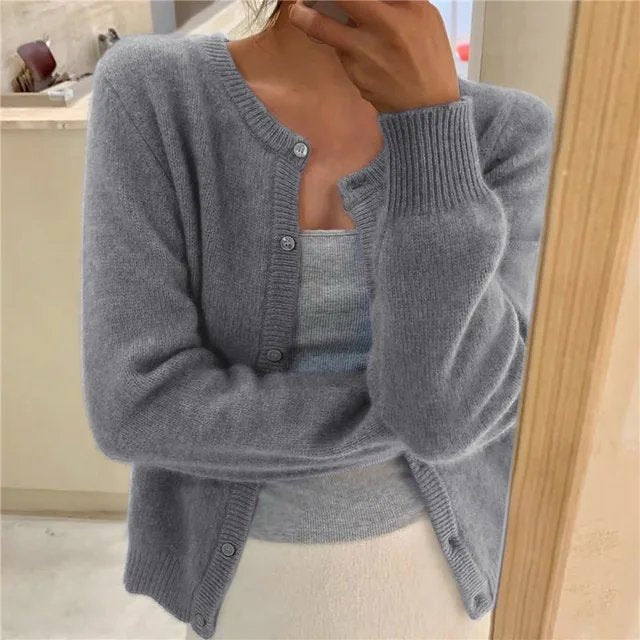 Women's cropped cardigan in white with button front, featuring a soft knit fabric and relaxed fit, perfect for layering in any season. 0