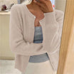 Women's cropped cardigan in white with button front, featuring a soft knit fabric and relaxed fit, perfect for layering in any season. 2