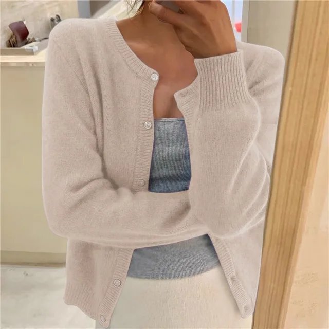 Women's cropped cardigan in white with button front, featuring a soft knit fabric and relaxed fit, perfect for layering in any season. 2