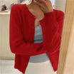 Women's cropped cardigan in white with button front, featuring a soft knit fabric and relaxed fit, perfect for layering in any season. 7