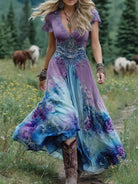 Women's floral maxi dress featuring a v-neck and short sleeves, designed with an elegant purple and blue print, perfect for summer events. 0