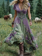 Women's floral maxi dress featuring a v-neck and short sleeves, designed with an elegant purple and blue print, perfect for summer events. 1