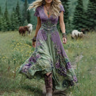Women's floral maxi dress featuring a v-neck and short sleeves, designed with an elegant purple and blue print, perfect for summer events. 5