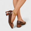 Women's croc-embossed patent leather loafers with block heel and stylish chain detail in a glossy finish. 0