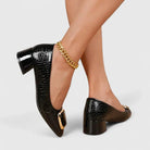Women's croc-embossed patent leather loafers with block heel and stylish chain detail in a glossy finish. 3