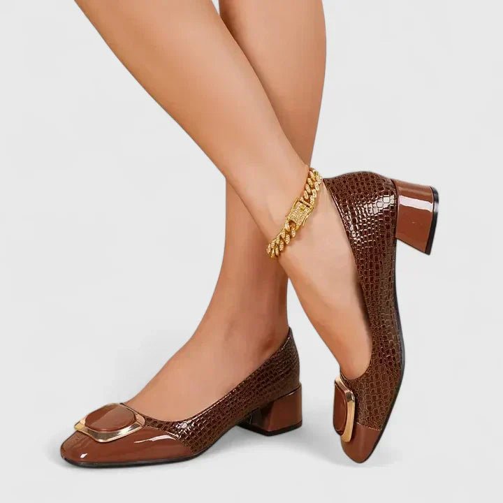 Women's croc-embossed patent leather loafers with block heel and stylish chain detail in a glossy finish. 4