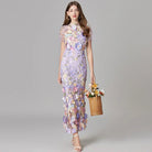 Elegant women's maxi dress featuring 3D floral appliques, sleeveless design, and a floor-length silhouette in vibrant yellow and white colors. 2