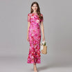 Elegant women's maxi dress featuring 3D floral appliques, sleeveless design, and a floor-length silhouette in vibrant yellow and white colors. 3