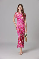Elegant women's maxi dress featuring 3D floral appliques, sleeveless design, and a floor-length silhouette in vibrant yellow and white colors. 4