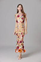 Elegant women's maxi dress featuring 3D floral appliques, sleeveless design, and a floor-length silhouette in vibrant yellow and white colors. 7